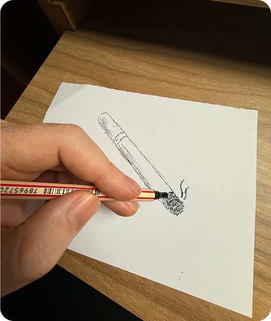 Hand sketching a cigarette to study the smoking gesture