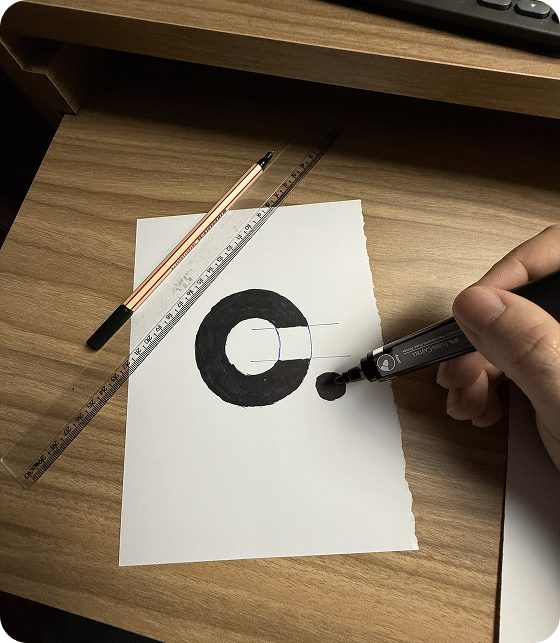 Hand drawing the interrupted-circle C symbol